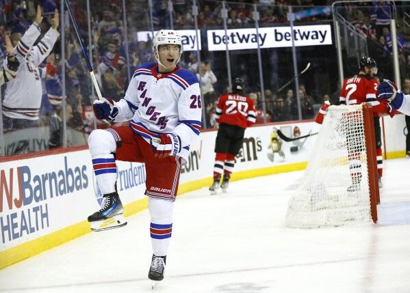 Vesey and Panarin each score twice as streaking Rangers beat rival